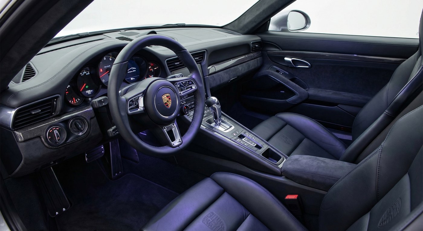 Porsche 911 interior cockpit with steering wheel and sport seats